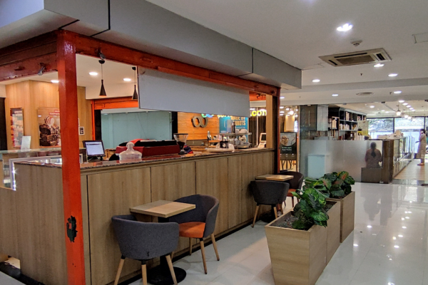 The photo captures a modern retail shop with a sleek design and a prominent glass façade. The location strategy here focuses on maximizing exposure within a high-density commercial real estate area like Salt Lake Sector V. The clear signage and accessible entry highlight the effort to create a welcoming and easily identifiable space, which is crucial for choosing a retail space that will capitalize on the busy environment to build brand potential