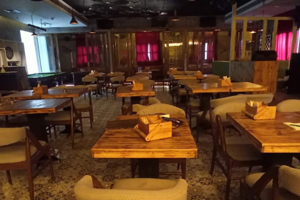 This spacious retail space felt perfect for his dream restaurant. He could already visualize the lively tables, the clinking glasses by the bar, and the friendly games of pool in the back. It was the ideal spot to build his new venture.