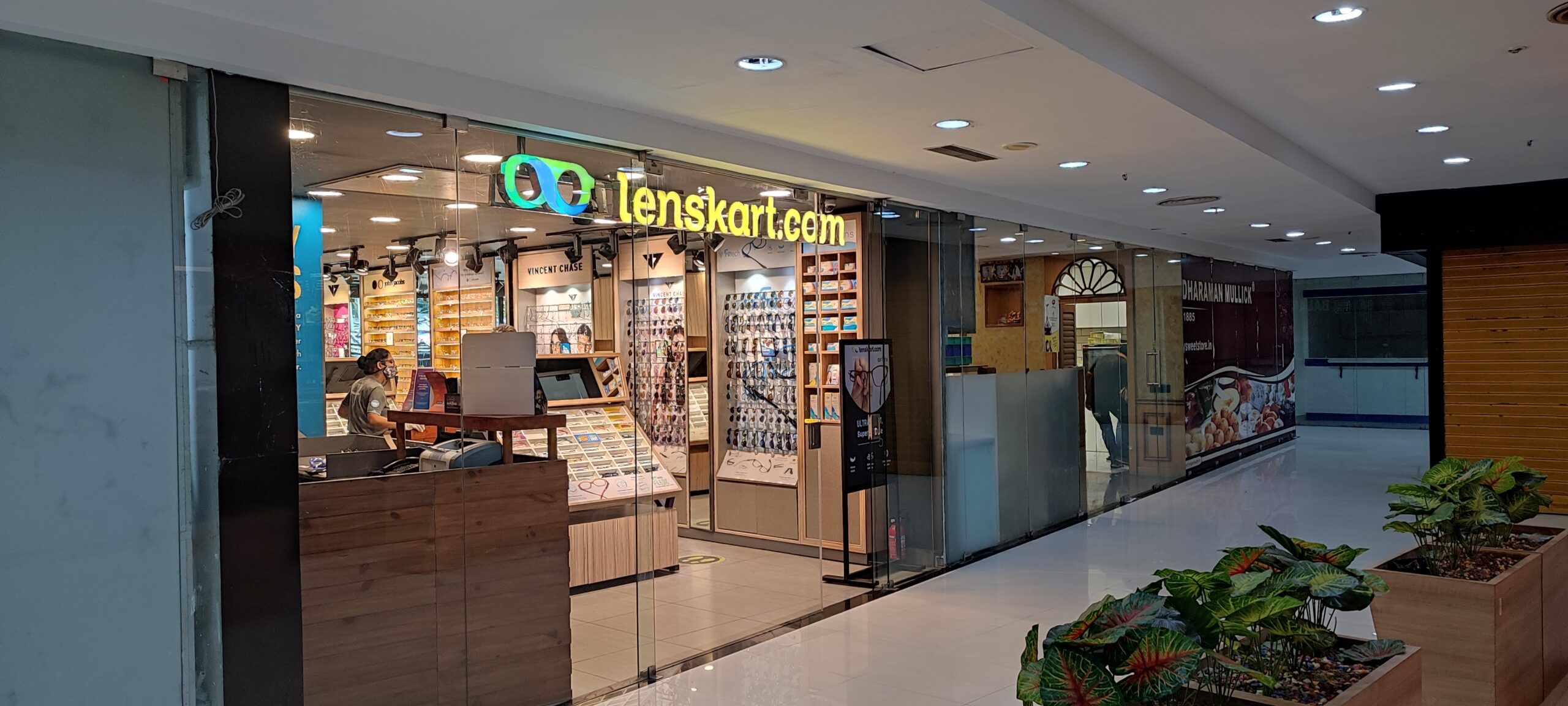 High-visibility retail spaces for flagship brands. This modern Lenskart outlet demonstrates the premium location and foot traffic available when you rent a shop within a commercial complex by Infinity.