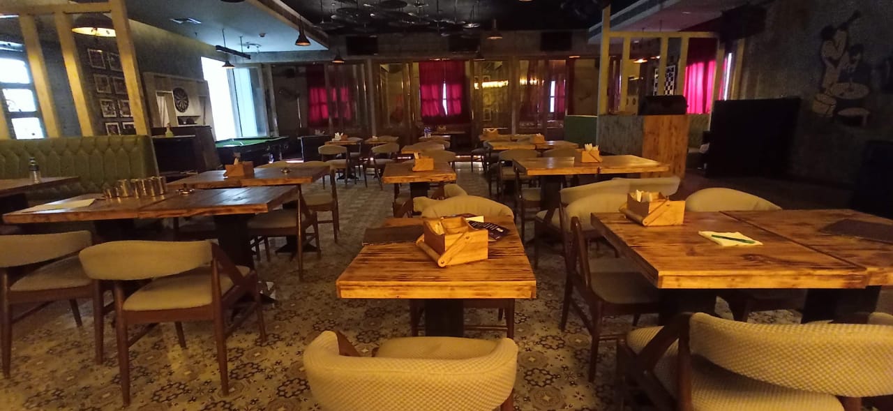 This spacious retail space felt perfect for his dream restaurant. He could already visualize the lively tables, the clinking glasses by the bar, and the friendly games of pool in the back. It was the ideal spot to build his new venture.